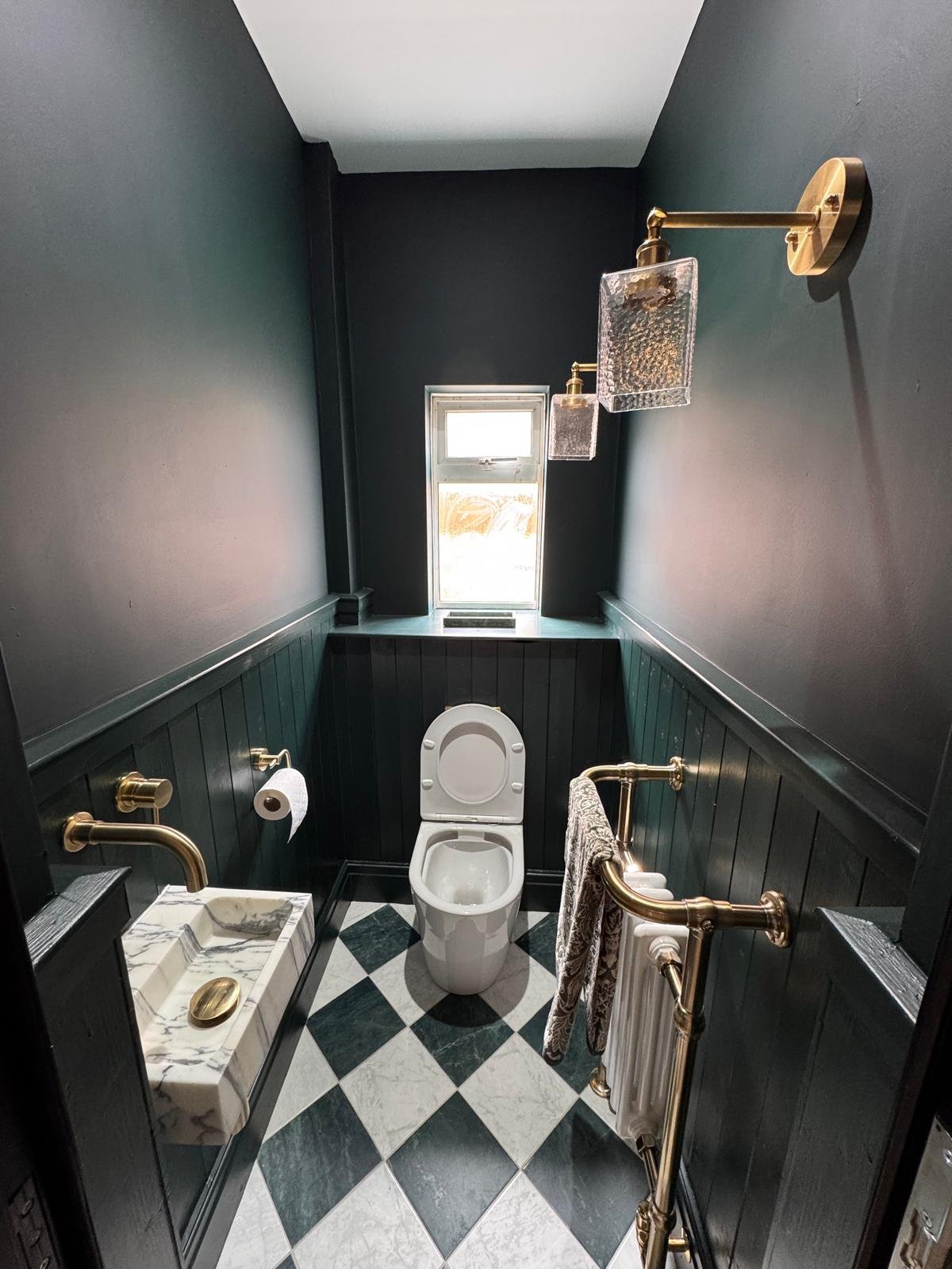 Cloakroom with dark walls