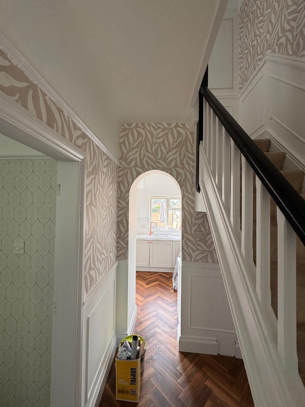 Hallway with patterned wallpaper